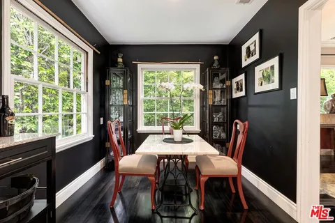 a kitchen with sink cabinets and wooden floor