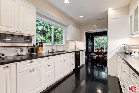 a view of a dining table and chairs in a room