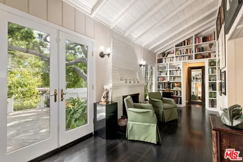 a bed room with a bed and a chair