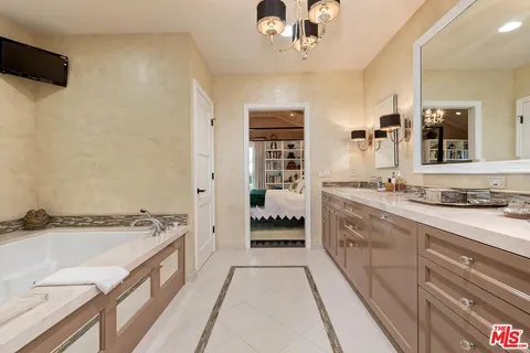a bathroom with a sink and a shower curtain