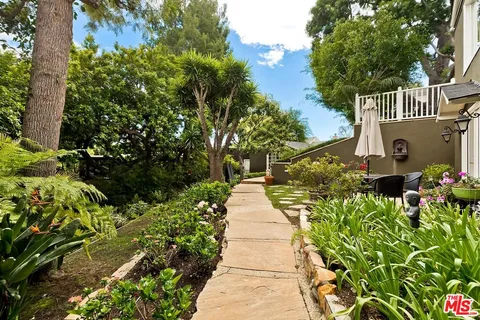 a view of a backyard with sitting area