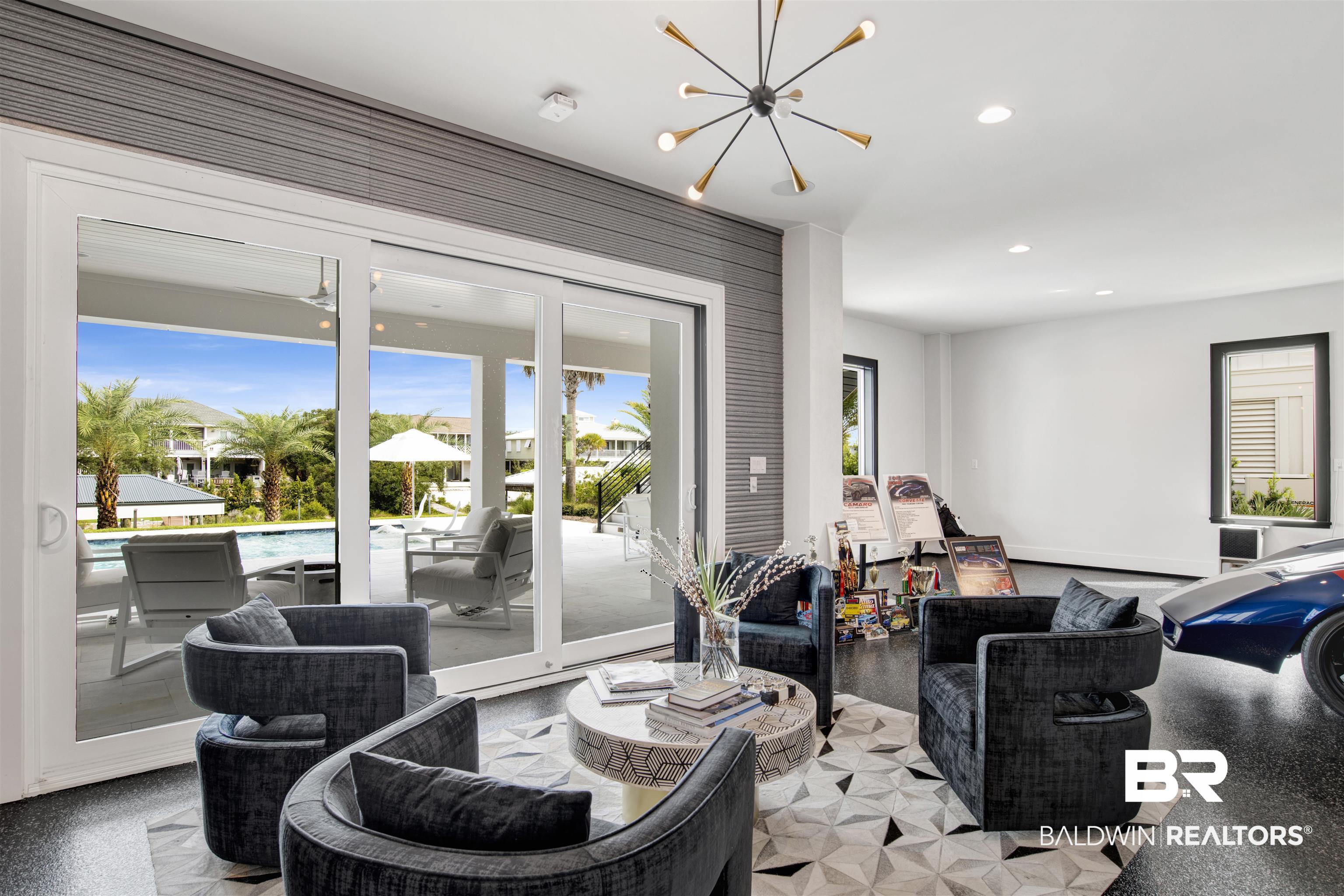 30239 Canal Court Orange Beach, AL 36561 - Photo 46 of 70 Living room with recessed lighting, speckle patterned floor, and a chandelier