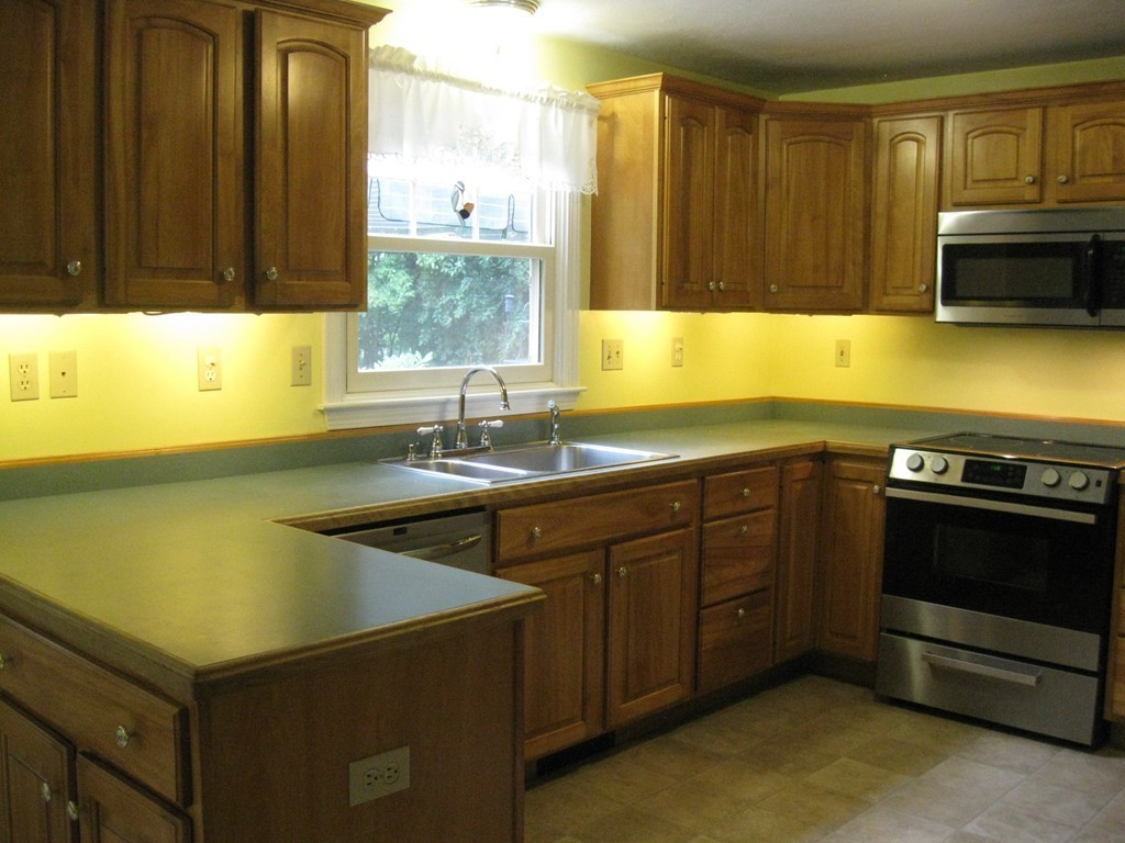 8 Abbey Road Walpole, MA 02071 - Photo 12 of 30 a kitchen with a sink and a stove