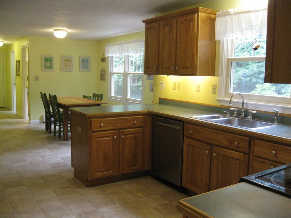 8 Abbey Road Walpole, MA 02071 - Photo 13 of 30 a kitchen with a sink and cabinets
