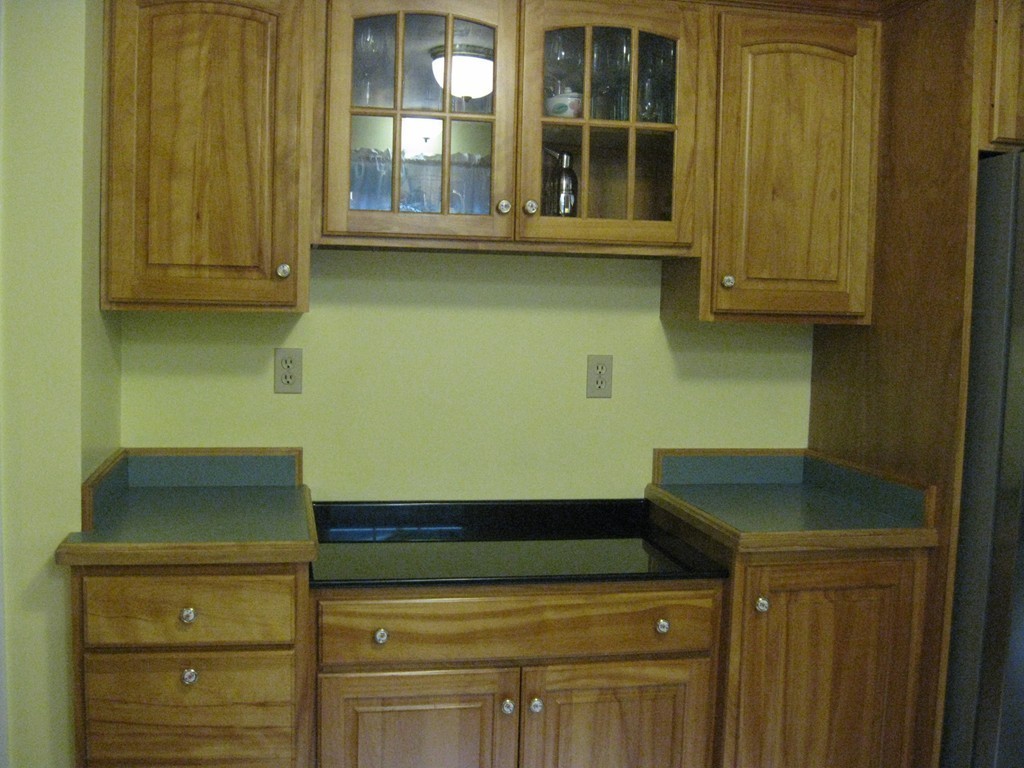 8 Abbey Road Walpole, MA 02071 - Photo 14 of 30 a kitchen with a sink and cabinets