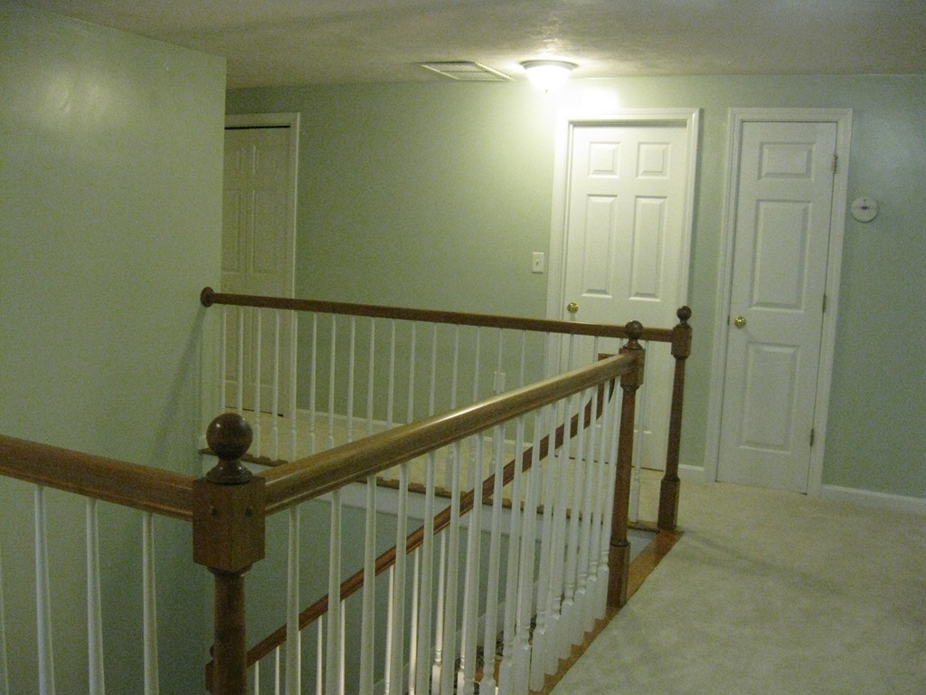 8 Abbey Road Walpole, MA 02071 - Photo 16 of 30 a view of staircase with railing and white walls
