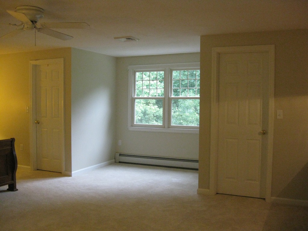 8 Abbey Road Walpole, MA 02071 - Photo 18 of 30 an empty room with windows