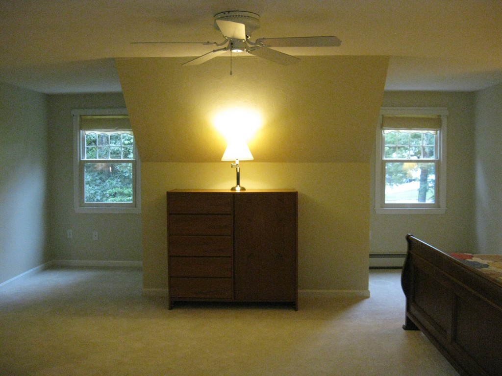 8 Abbey Road Walpole, MA 02071 - Photo 19 of 30 a room with a dresser and a window