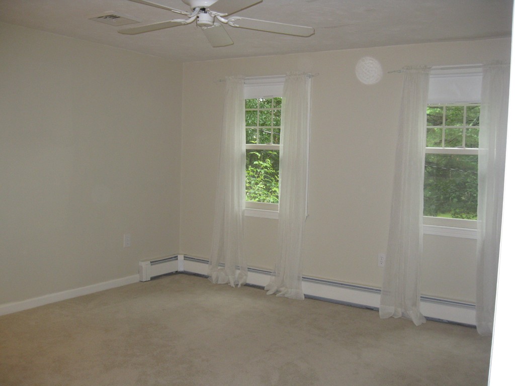 8 Abbey Road Walpole, MA 02071 - Photo 22 of 30 an empty room with a window