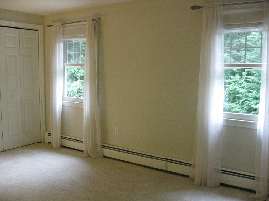 8 Abbey Road Walpole, MA 02071 - Photo 23 of 30 a view of an empty room and window