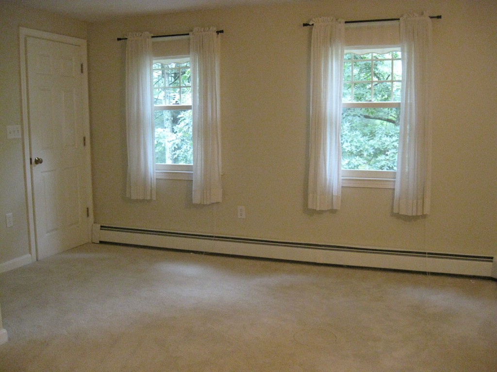 8 Abbey Road Walpole, MA 02071 - Photo 24 of 30 an empty room with a window