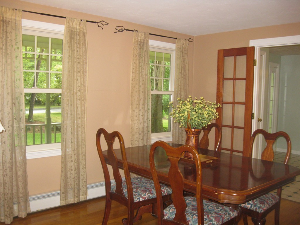 8 Abbey Road Walpole, MA 02071 - Photo 9 of 30 a view of a dining room with furniture window and wooden floor