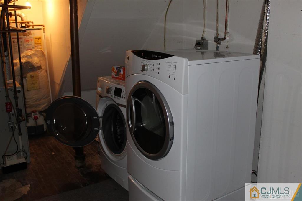 2 R Quincy Circle, Unit R2 Dayton, NJ 08810 - Photo 16 of 18 a utility room with dryer and washer