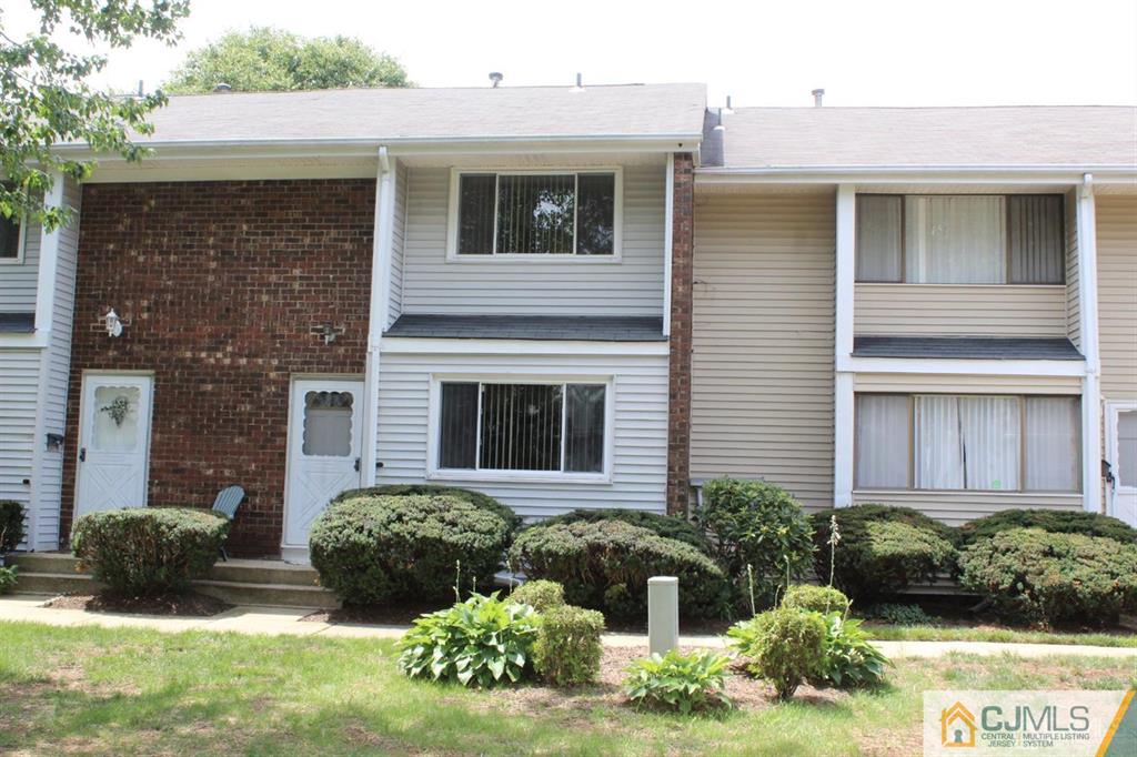 2 R Quincy Circle, Unit R2 Dayton, NJ 08810 - Photo 2 of 18 a view of a house with a yard and plants