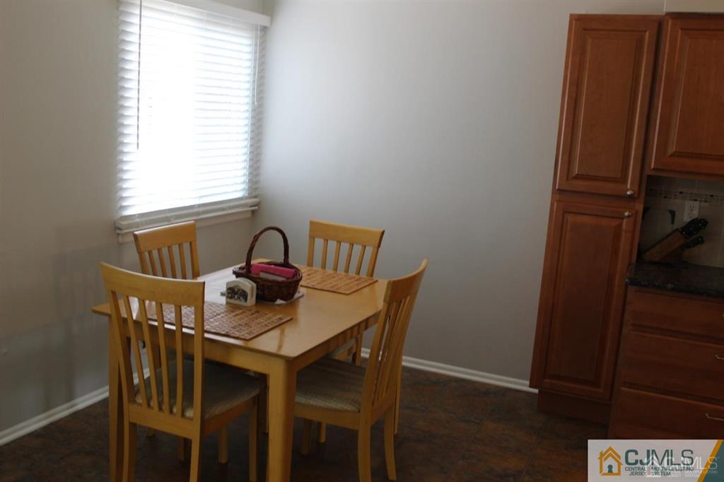 2 R Quincy Circle, Unit R2 Dayton, NJ 08810 - Photo 7 of 18 a dining room with furniture and window