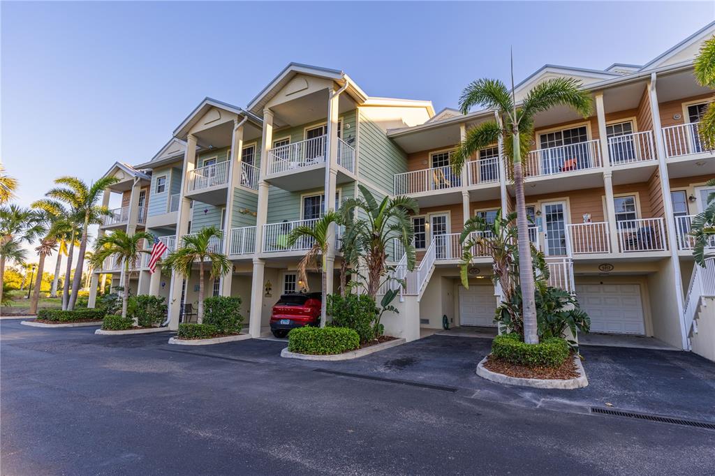 3210 Mangrove Point Drive Ruskin, FL 33570 - Photo 3 of 48 a front view of multi story residential apartment building with yard
