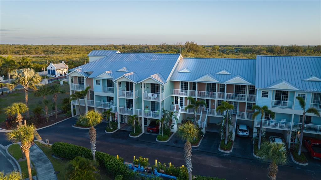 3210 Mangrove Point Drive Ruskin, FL 33570 - Photo 35 of 48 an aerial view of multiple houses with a yard