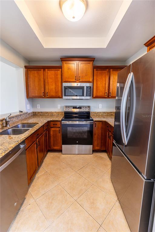 3210 Mangrove Point Drive Ruskin, FL 33570 - Photo 8 of 48 a kitchen with a sink a stove and cabinets