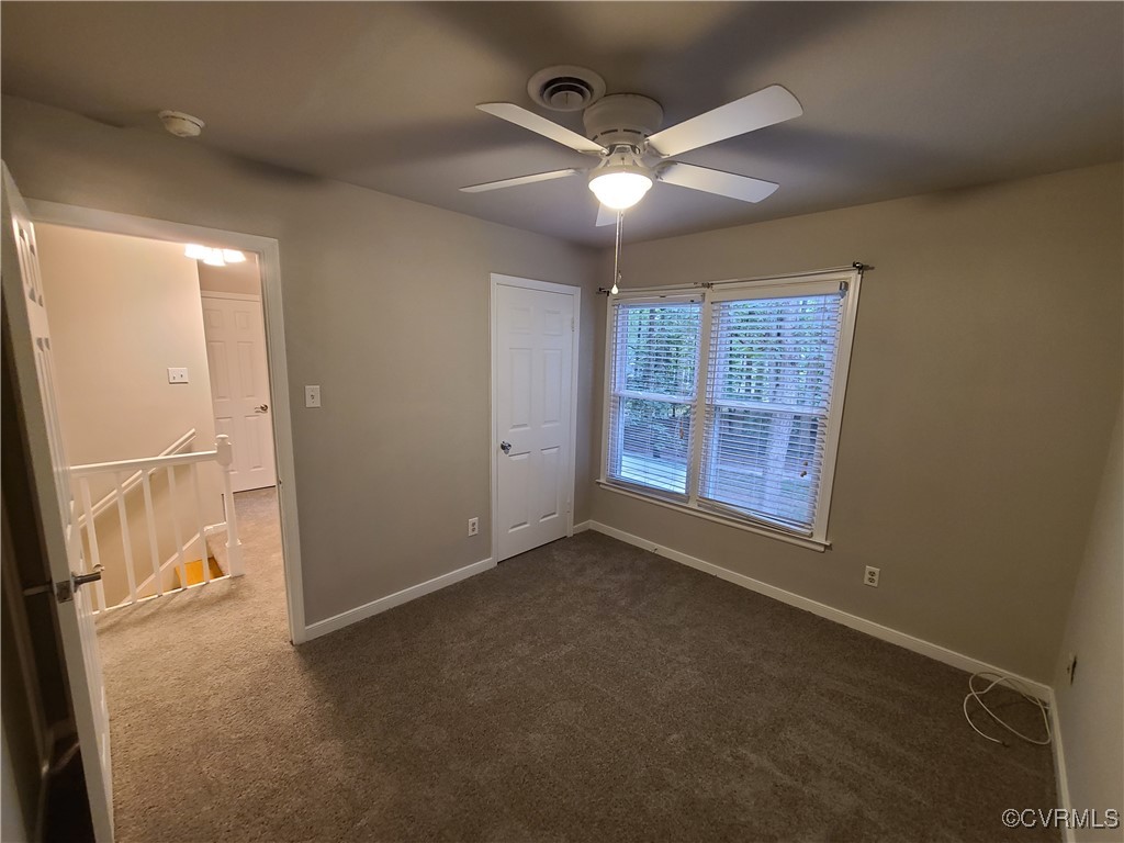 5800 Mill Spring Lane Midlothian, VA 23112 - Photo 13 of 29 an empty room with windows and fan
