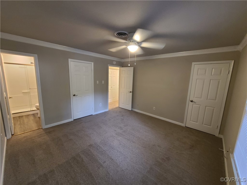 5800 Mill Spring Lane Midlothian, VA 23112 - Photo 15 of 29 an empty room with chandelier fan and windows