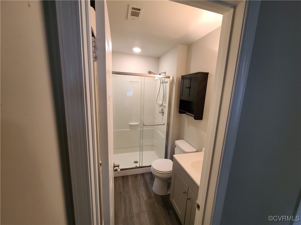 5800 Mill Spring Lane Midlothian, VA 23112 - Photo 16 of 29 a bathroom with a granite countertop toilet sink and shower