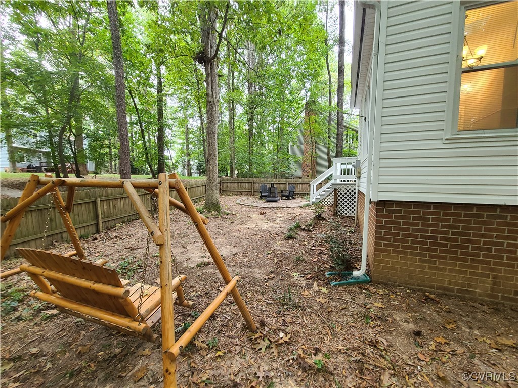 5800 Mill Spring Lane Midlothian, VA 23112 - Photo 24 of 29 a view of a backyard with sitting area