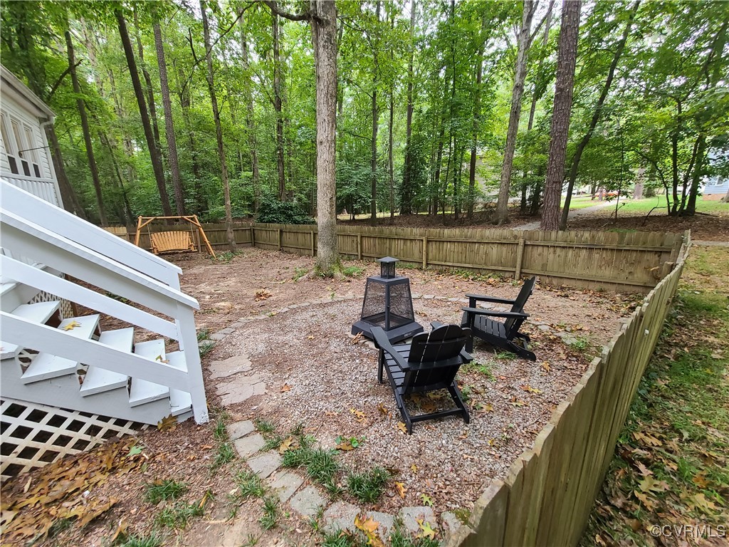 5800 Mill Spring Lane Midlothian, VA 23112 - Photo 25 of 29 a view of a lake with outdoor seating