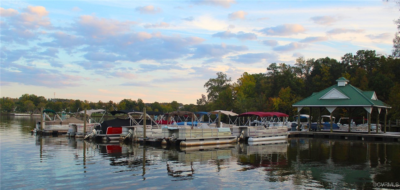 5800 Mill Spring Lane Midlothian, VA 23112 - Photo 27 of 29 a view of a lake with a table and chairs