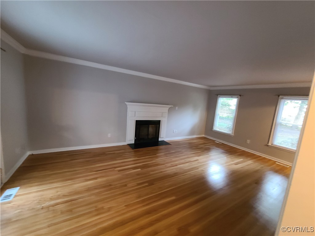5800 Mill Spring Lane Midlothian, VA 23112 - Photo 7 of 29 a view of an empty room with window and wooden floor