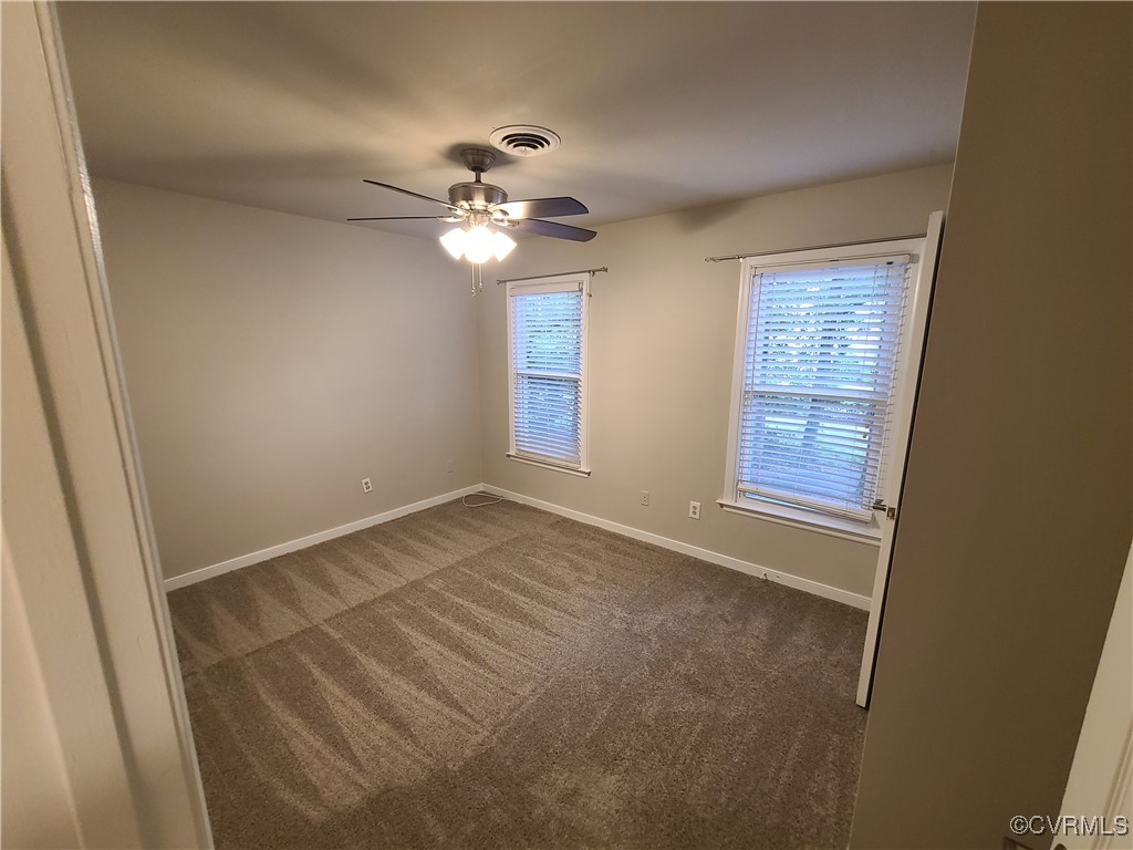 5800 Mill Spring Lane Midlothian, VA 23112 - Photo 10 of 29 an empty room with windows and fan