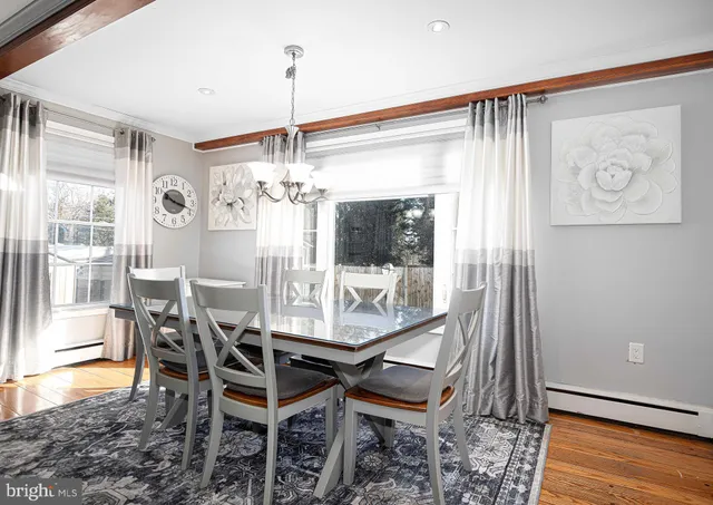 a dining room with furniture and window