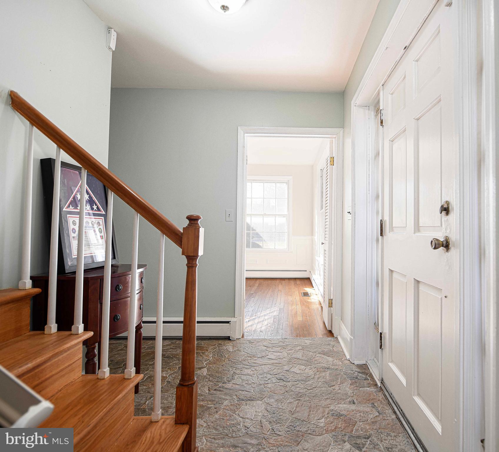 6701 Loch Raven Boulevard Baltimore, MD 21286 - Photo 19 of 44 a view of entryway with wooden floor and stairs