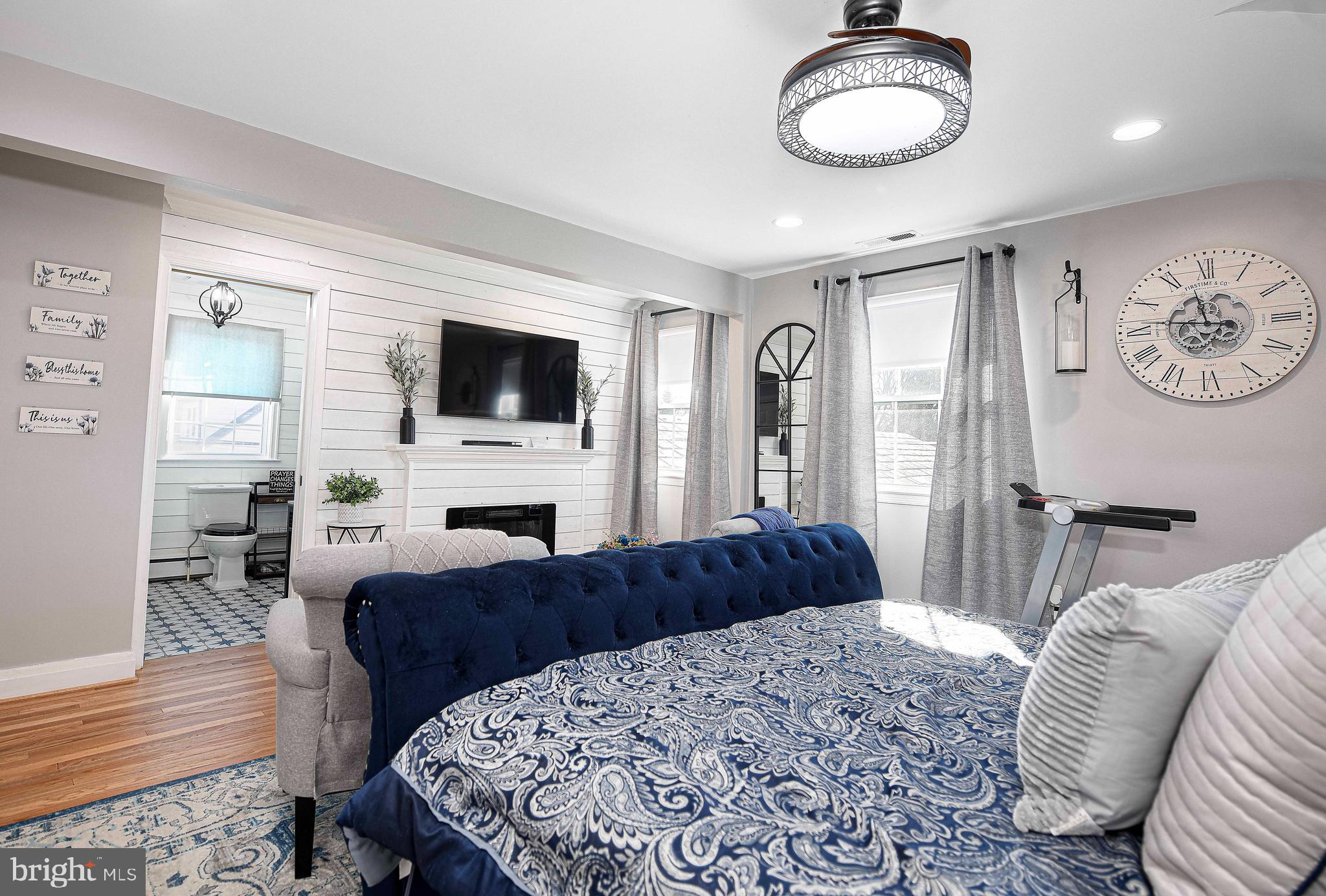 6701 Loch Raven Boulevard Baltimore, MD 21286 - Photo 22 of 44 a bedroom with a large bed and a flat screen tv