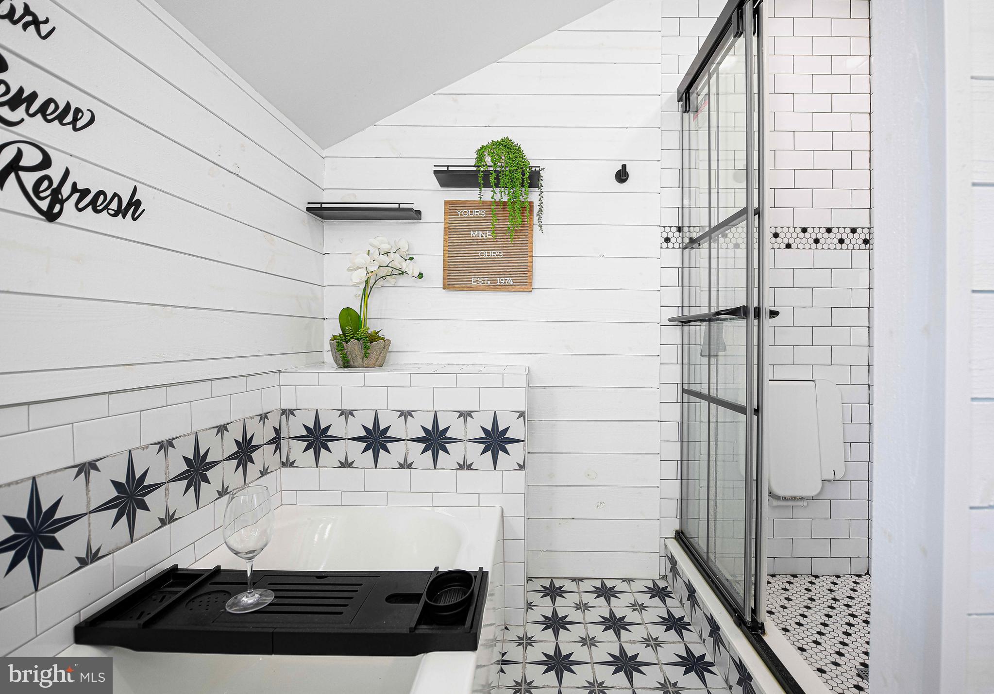 6701 Loch Raven Boulevard Baltimore, MD 21286 - Photo 25 of 44 a bathroom with a bathtub