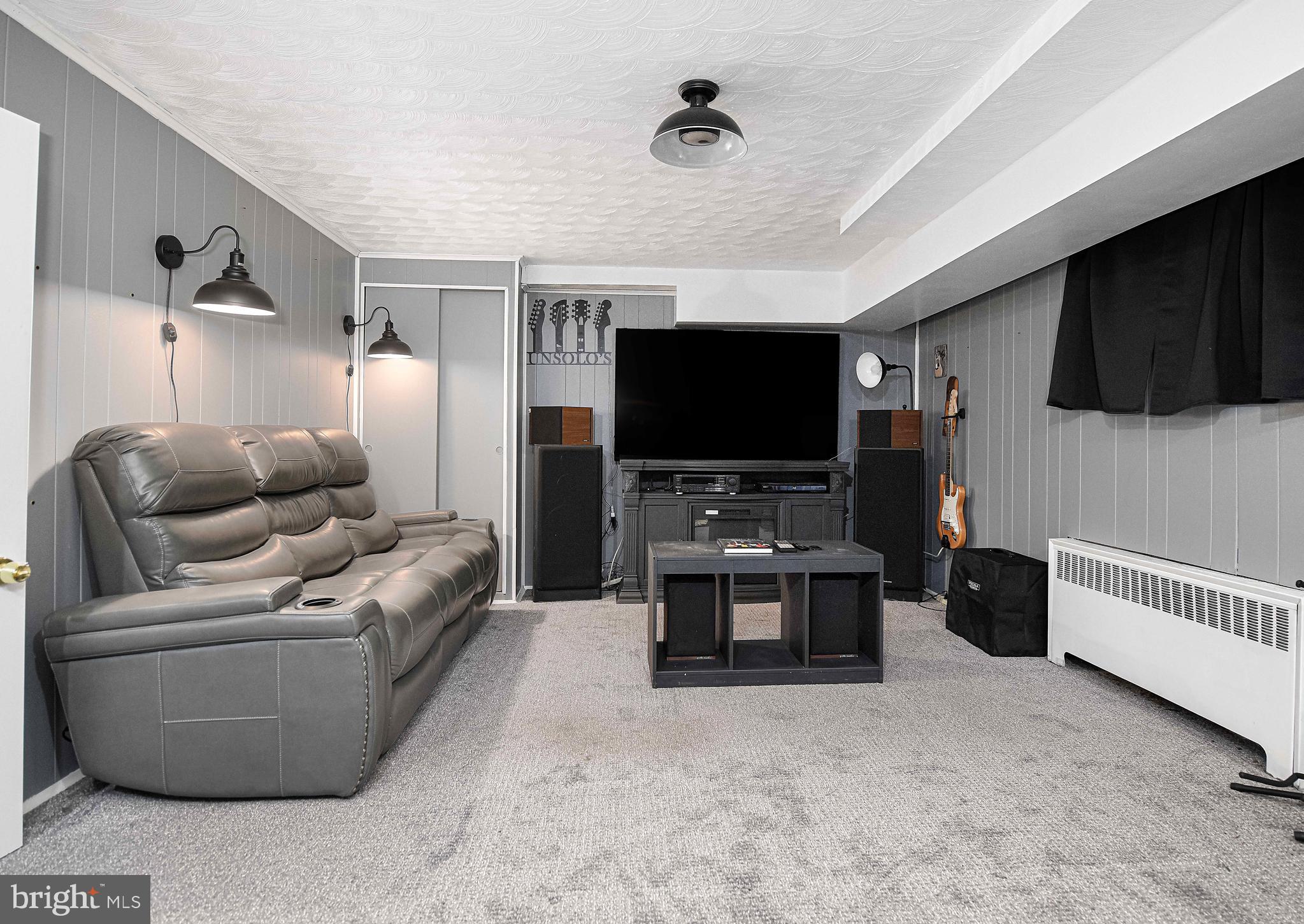 6701 Loch Raven Boulevard Baltimore, MD 21286 - Photo 33 of 44 a living room with furniture and a flat screen tv
