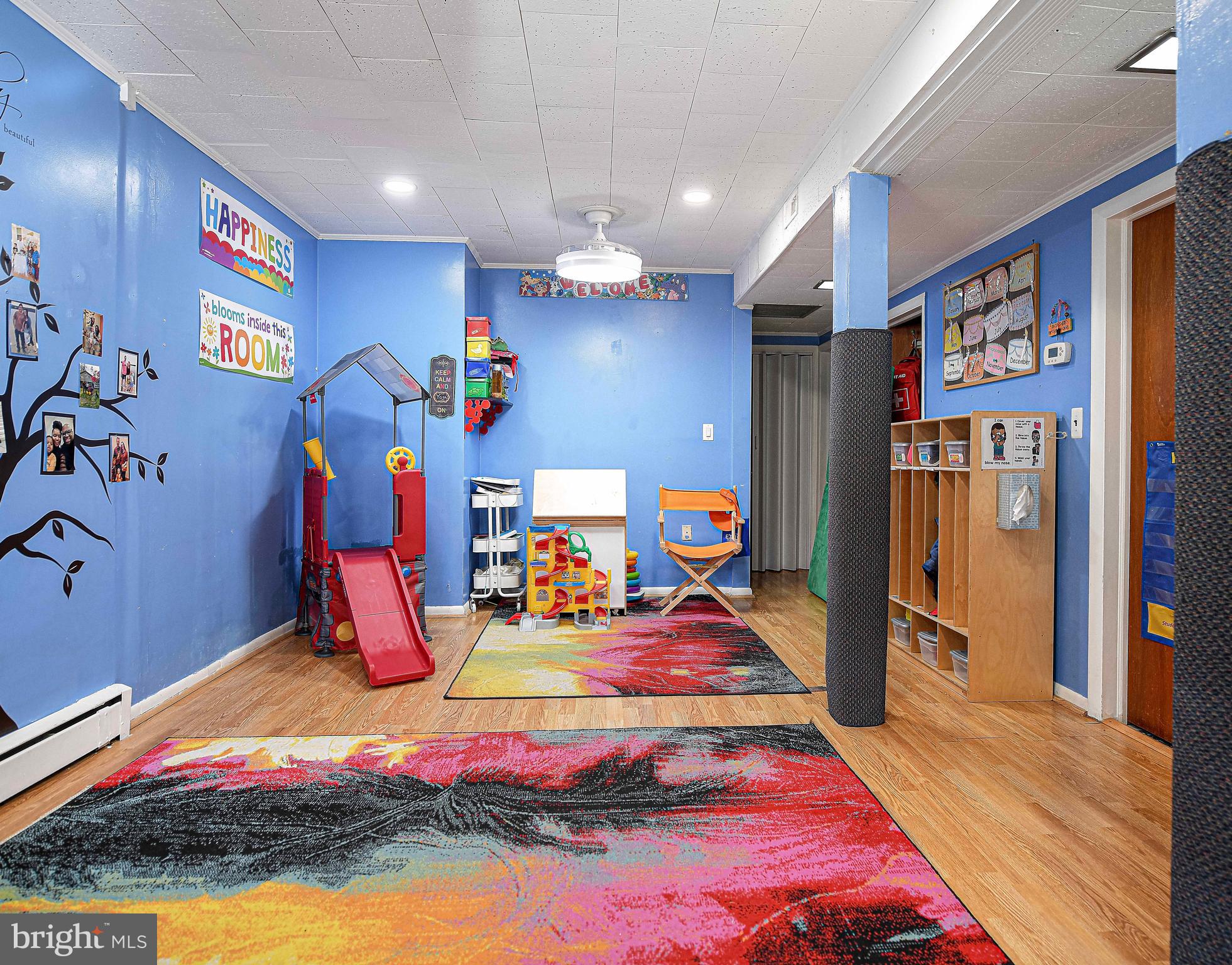 6701 Loch Raven Boulevard Baltimore, MD 21286 - Photo 37 of 44 a bed room with furniture and a flat screen tv