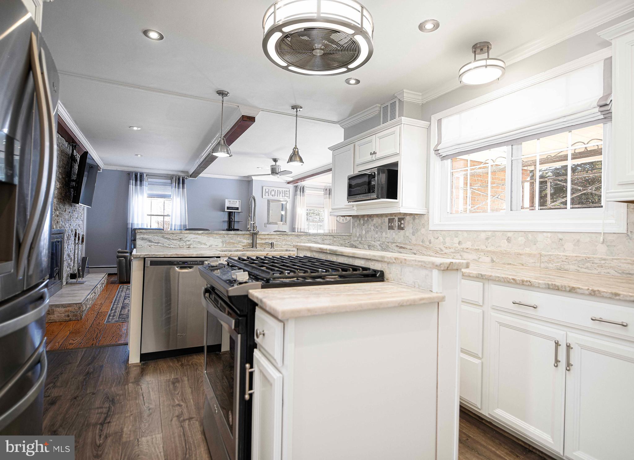 6701 Loch Raven Boulevard Baltimore, MD 21286 - Photo 6 of 44 a kitchen with stainless steel appliances granite countertop a stove and a sink
