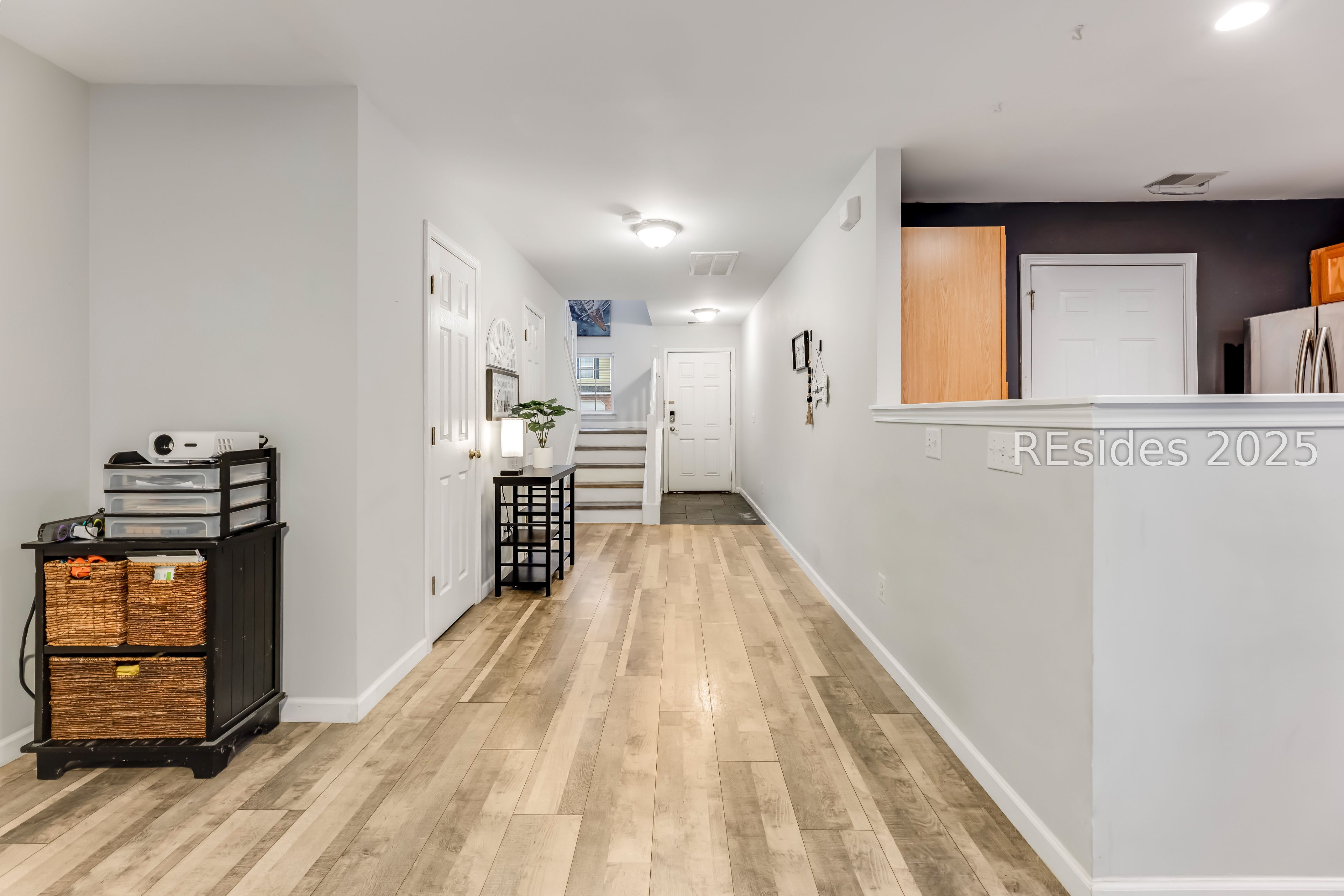 113 Cross Road Bluffton, SC 29910 - Photo 9 of 30 Entryway and door to first-floor half bath