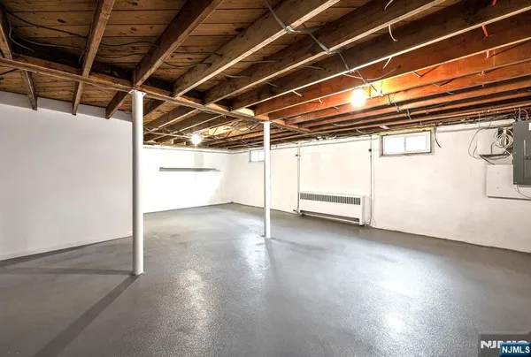 a view of a room with wooden floors