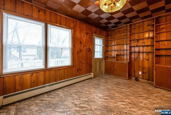 a view of empty room with windows