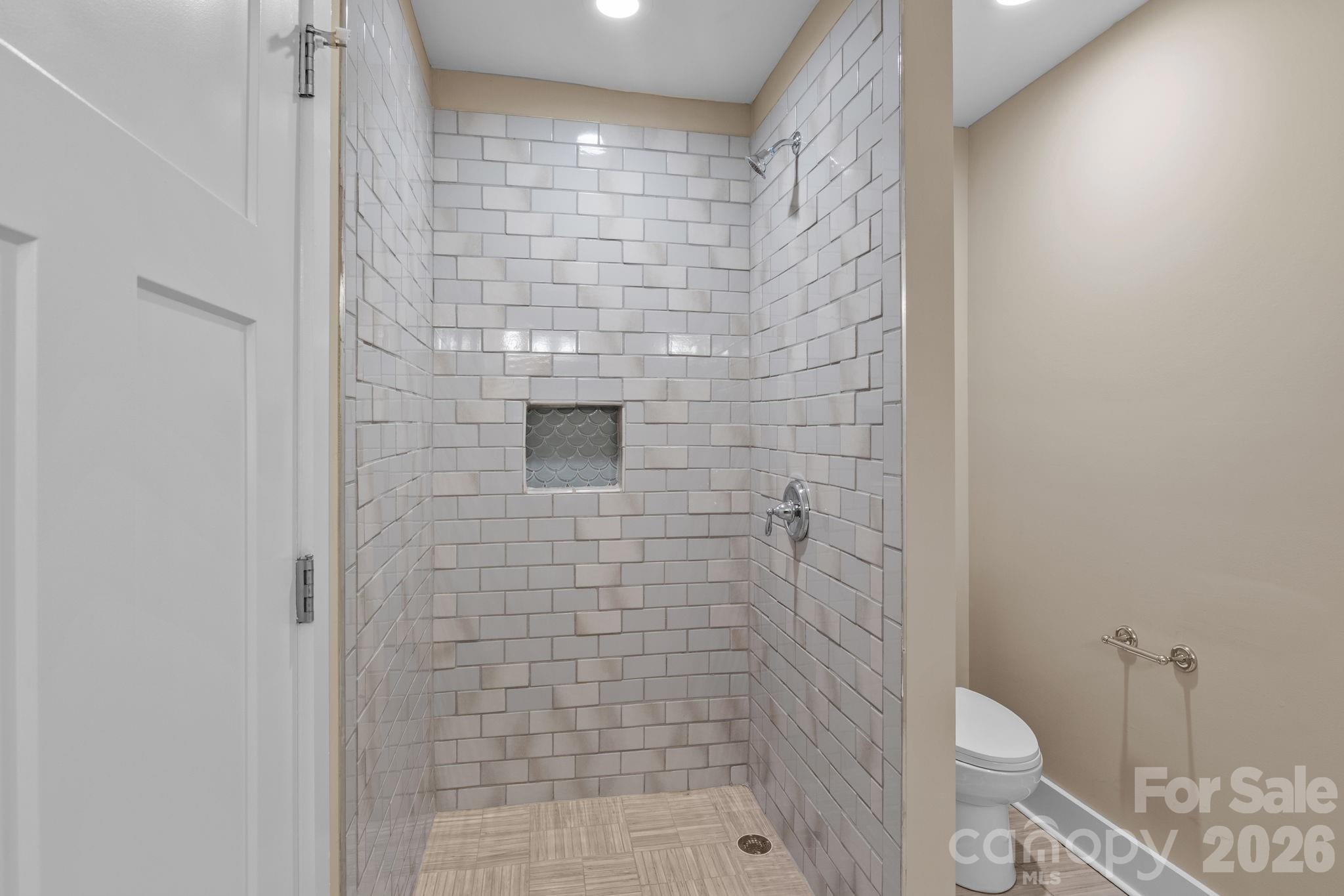 996 Cornelius Road Mooresville, NC 28117 - Photo 19 of 26 a bathroom with a toilet and a shower