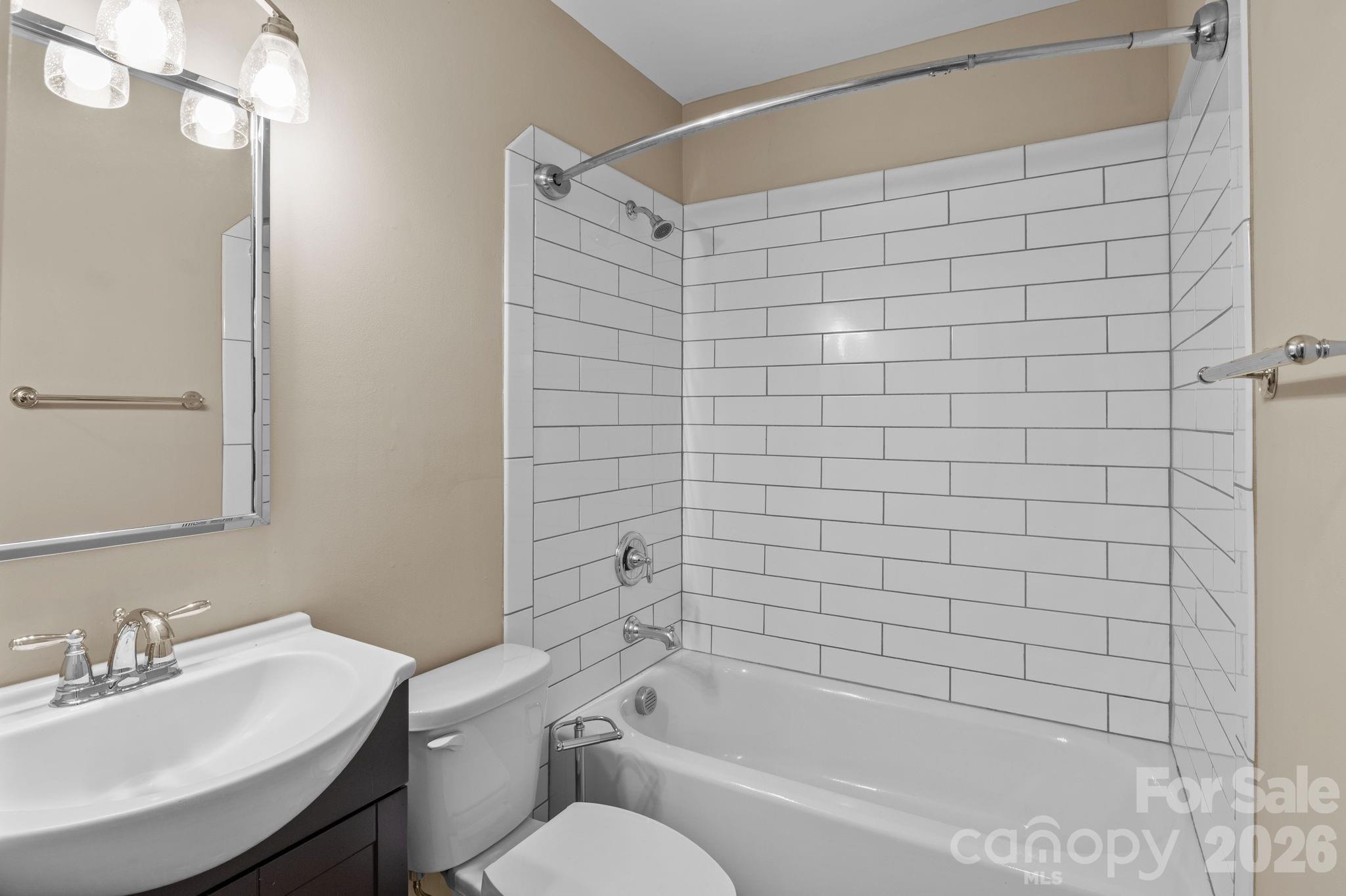 996 Cornelius Road Mooresville, NC 28117 - Photo 22 of 26 a bathroom with a bathtub shower sink vanity and toilet
