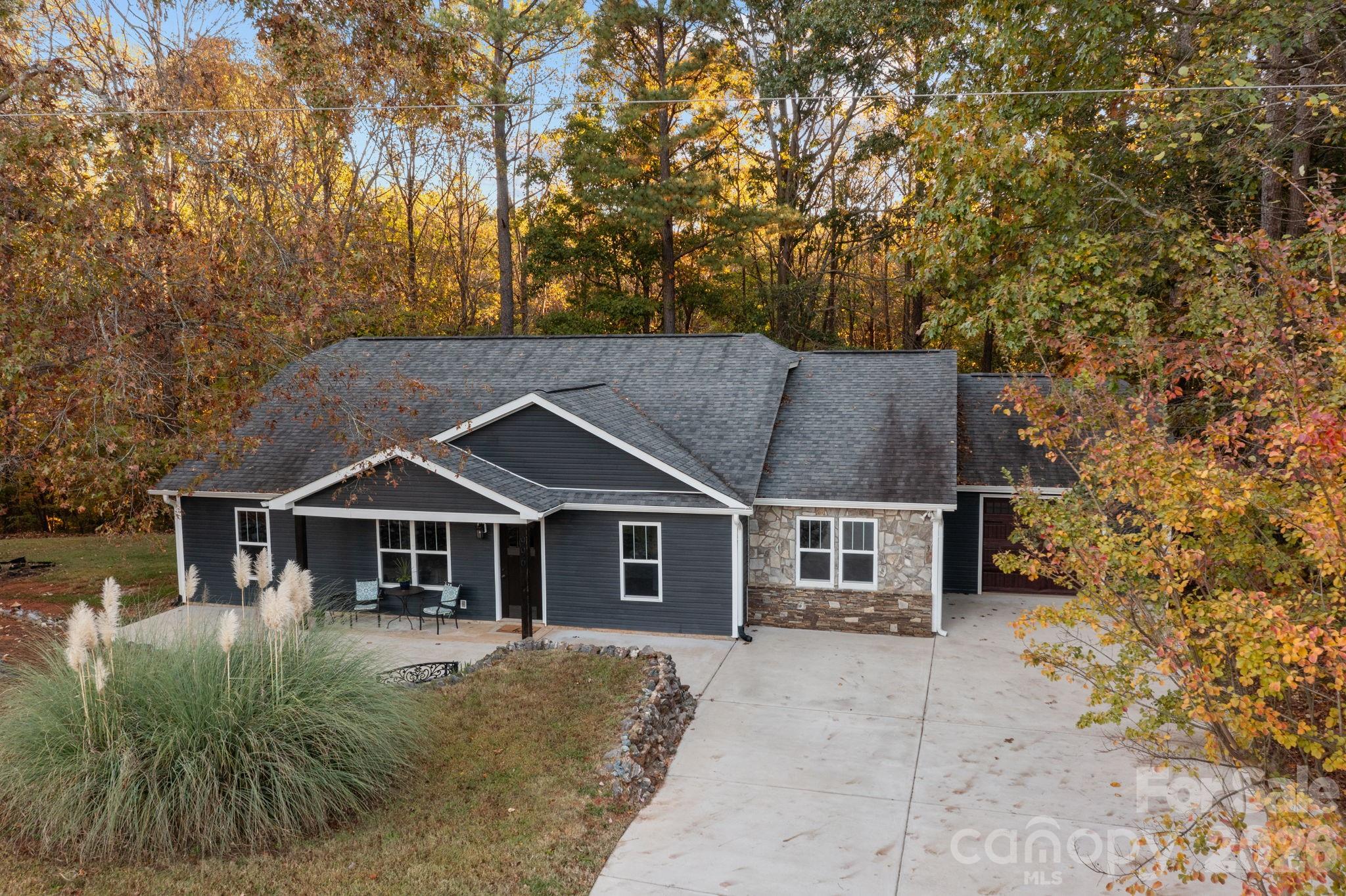 996 Cornelius Road Mooresville, NC 28117 - Photo 23 of 26 front view of a house with a garden