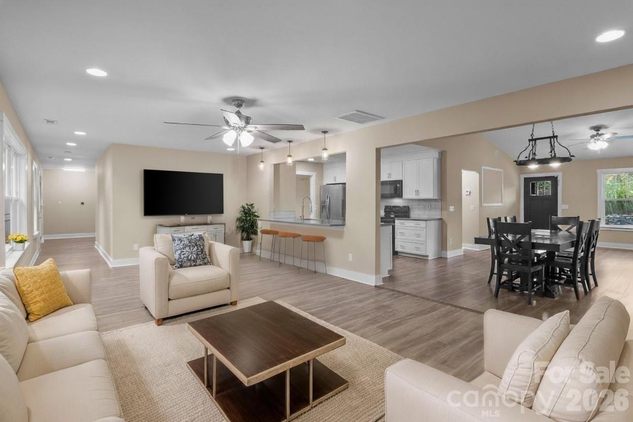 996 Cornelius Road Mooresville, NC 28117 - Photo 3 of 26 a living room with furniture and a flat screen tv