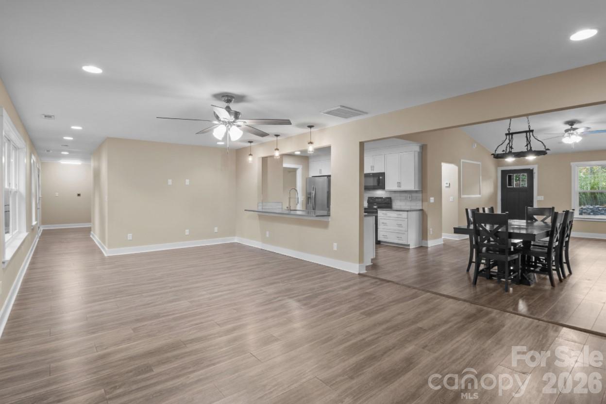 996 Cornelius Road Mooresville, NC 28117 - Photo 4 of 26 a view of a kitchen and dining room