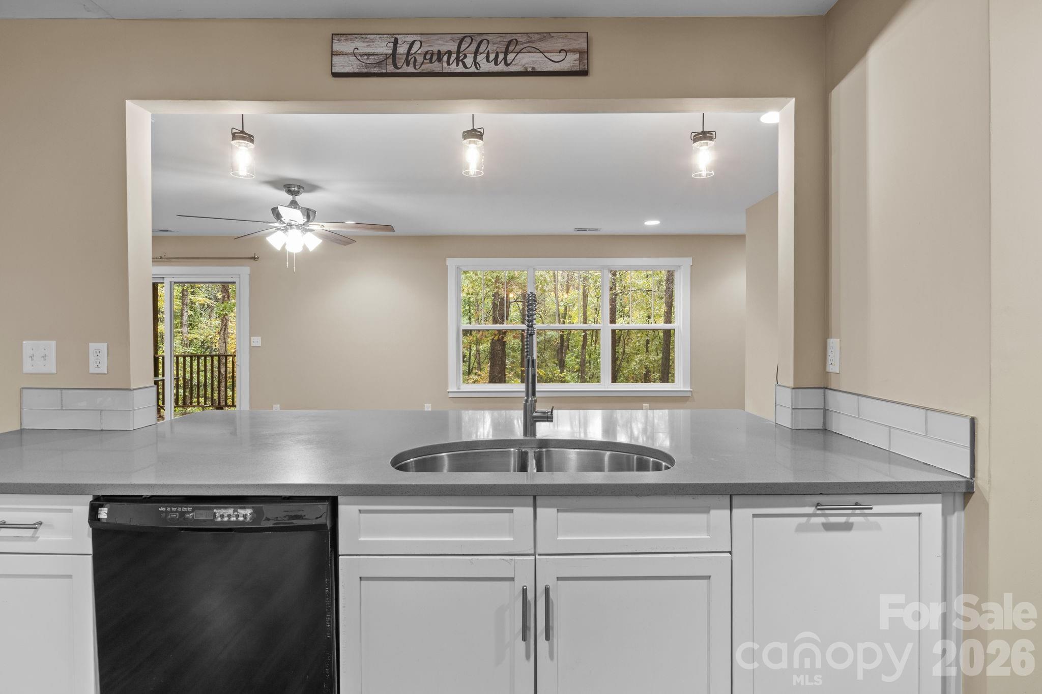 996 Cornelius Road Mooresville, NC 28117 - Photo 8 of 26 a kitchen with a sink and cabinets