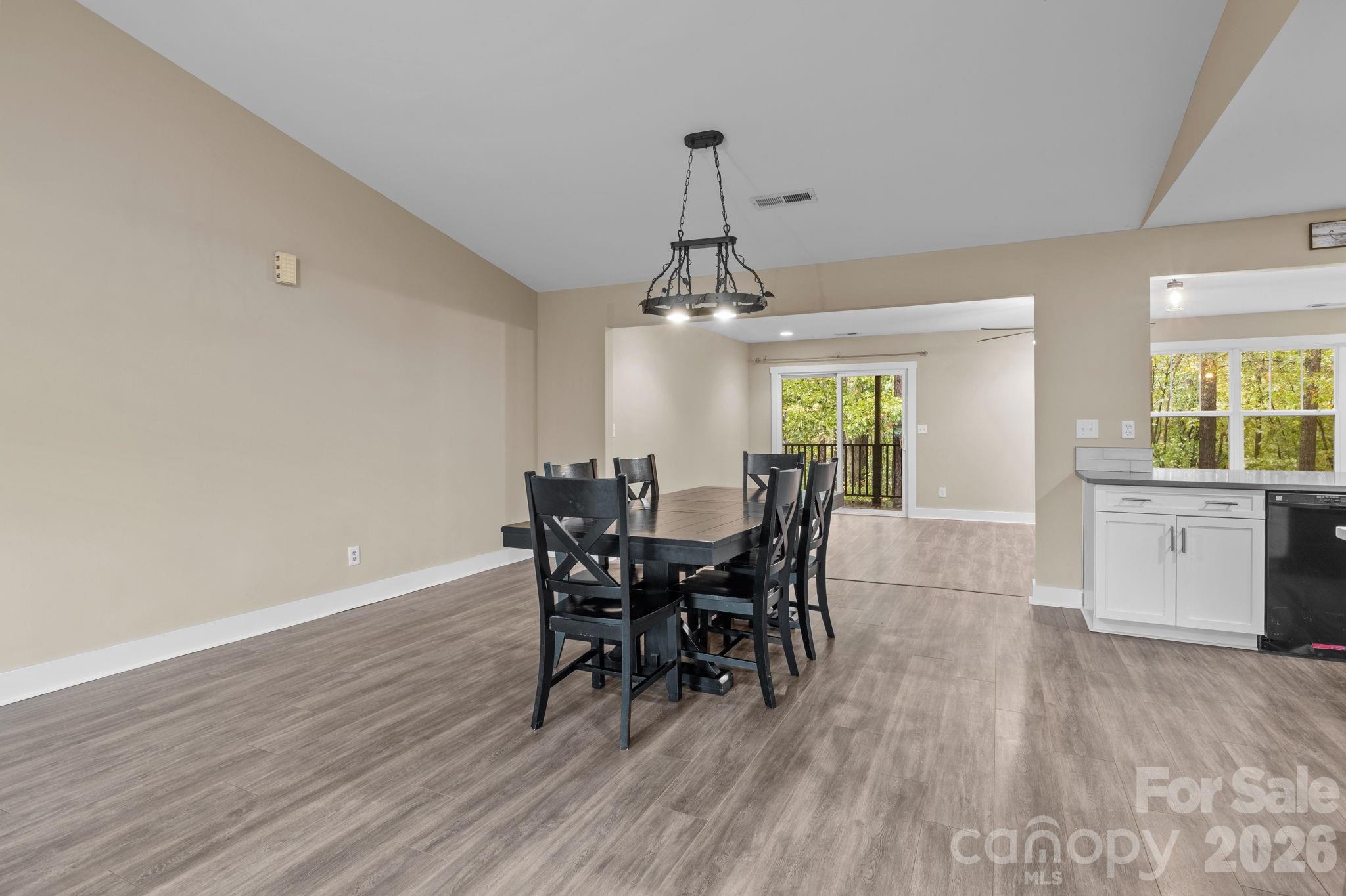 996 Cornelius Road Mooresville, NC 28117 - Photo 10 of 26 a view of a dining room with furniture and window