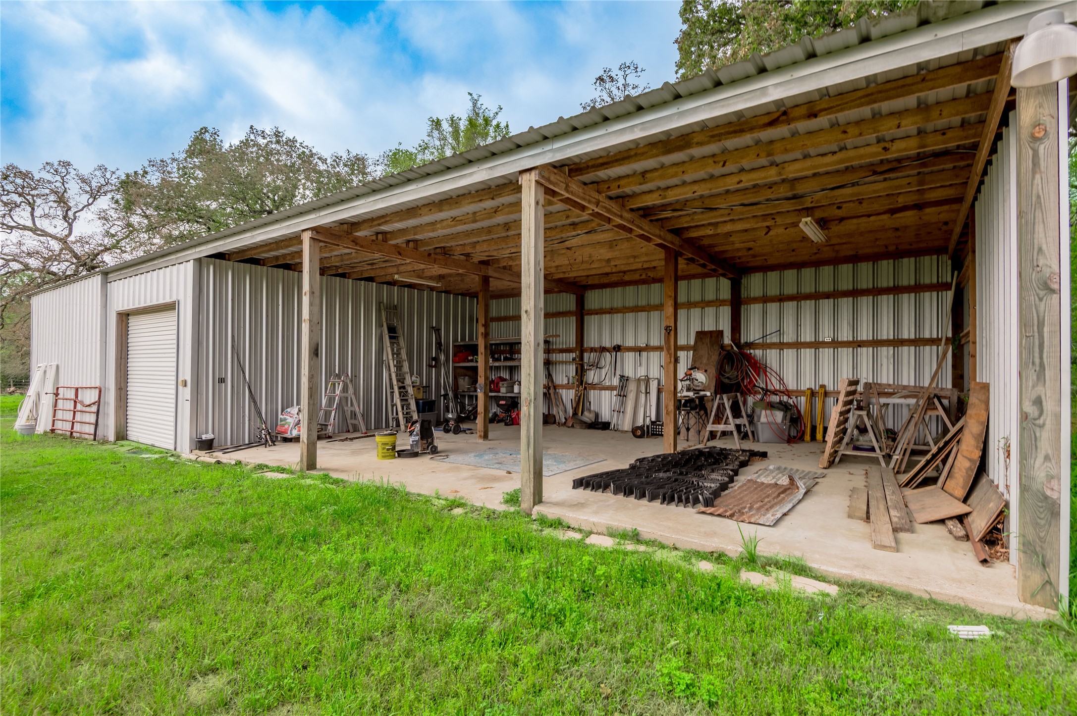 758 Wire Road Huntsville, TX 77320 - Photo 31 of 44 a view of a backyard with sitting area and tub
