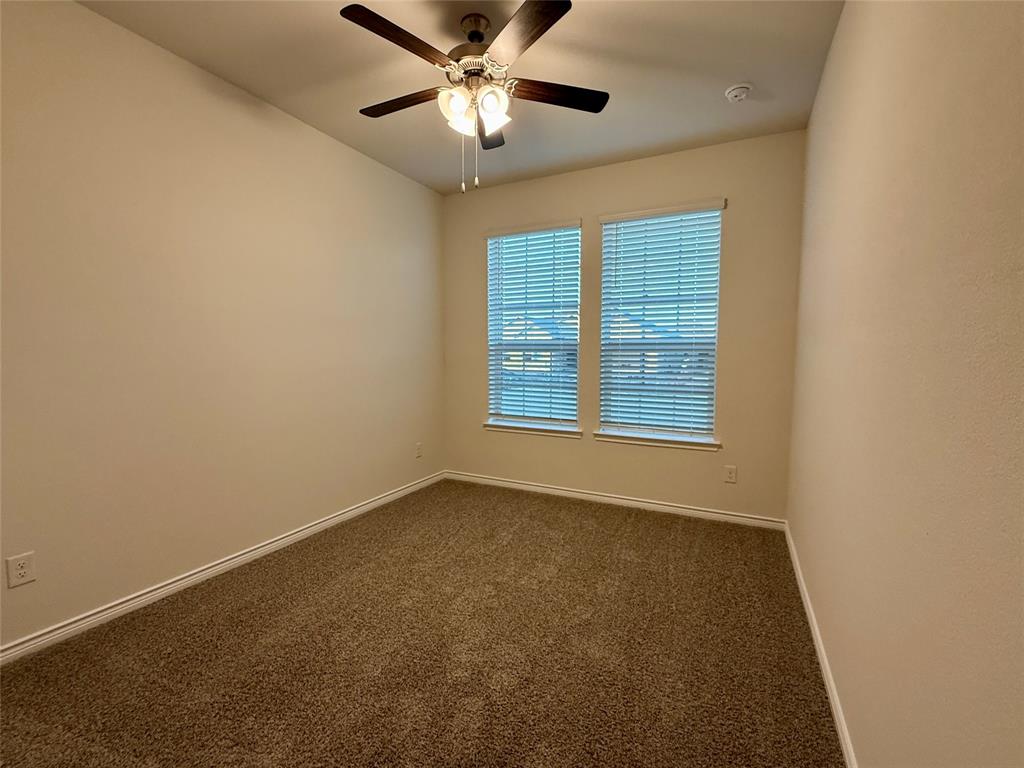 2025 Eugene Street Anna, TX 75409 - Photo 19 of 32 an empty room with a window and a fan