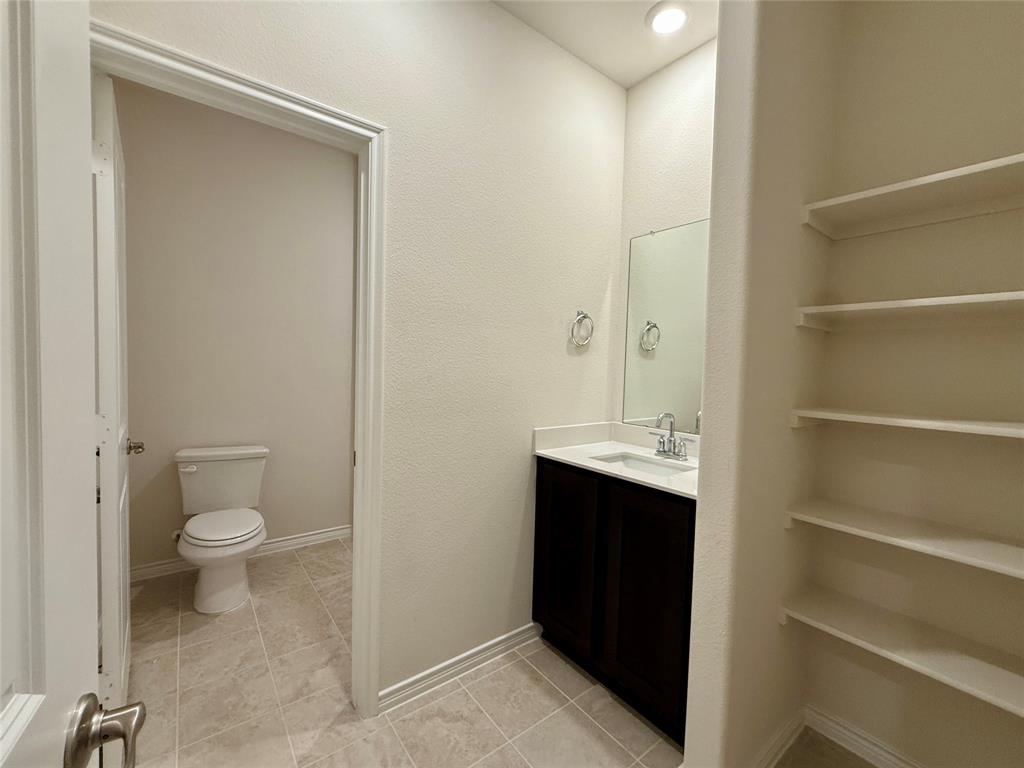 2025 Eugene Street Anna, TX 75409 - Photo 22 of 32 a bathroom with a sink and a toilet